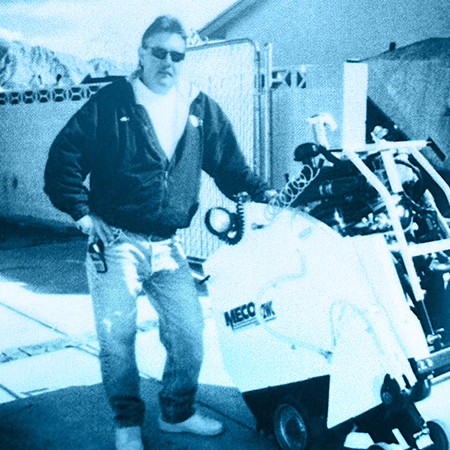 Worker using saw to cut through brick