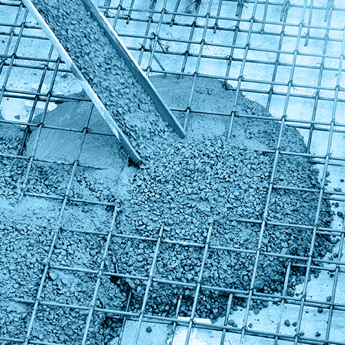 Wet concrete pouring down funnel