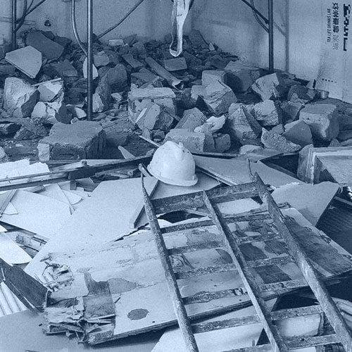 Hard hat in middle of demolished room