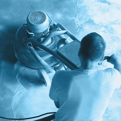 Man using floor grinder or polisher